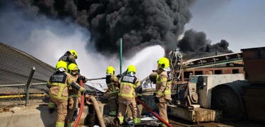 Dubai Civil Defense teams work to put out a fire in Jebel Ali's Industrial Area on Monday October 18, 2021. (Twitter)