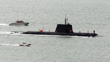 The Submarine HMAS DECHAINEUX from Australia arrives in the Waitemata Harbour as part of the fleet entry to celebrate the Royal New Zealand Navy's 75th anniversary in Auckland on November 16, 2016. (Photo by Michael BRADLEY / AFP)