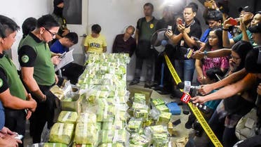 The Philippine Drug Enforcement Agency officials with a haul of drugs. (File photo: AP)