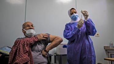 An Egyptian medical worker administers a dose of the Oxford-AstraZeneca Covid-19 vaccine (Covishield) on March 4, 2021 in Cairo on the first day of vaccination in Egypt. (AFP)