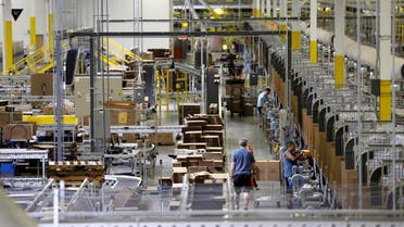 Workers sort products at an Amazon Fulfilment Center in Tracy, California. (Reuters)