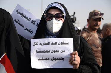 من تظاهرة لأنصار الحشد ضد الانتخابات النيابية في العراق (فرانس برس)