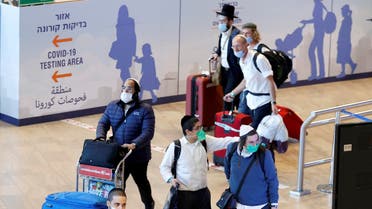 Ultra-Orthodox Jewish men arrive at the Israeli Ben Gurion airport near the coastal city of Tel Aviv on September 9, 2021. (AFP)