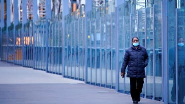 A woman wearing a protective face mask walks along a deserted city bridge during morning commute hours on the first day of a lockdown as the state of Victoria looks to curb the spread of a coronavirus disease (COVID-19) outbreak in Melbourne, Australia, July 16, 2021. (File Photo: Reuters)