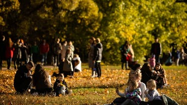 People rest in a park during sunny Autumn weather in Moscow, Russia, October 10, 2021. REUTERS/Maxim Shemetov