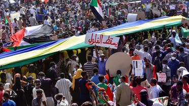 Sudanese demonstrators take part in aprotest in the city of Khartoum Bahri, the northern twin city of the capital, to demand the government's transition to civilian rule, on October 21, 2021. (AFP)