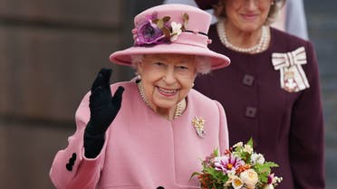  In this file photo taken on October 14, 2021 Britain's Queen Elizabeth II waves as she leaves after attending the ceremonial opening of the sixth Senedd, the Welsh Parliament, in Cardiff, Wales. (AFP)