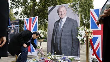 Members of the Anglo-Iranian community and supporters of the National Council of Resistance of Iran (NCRI) attend a memorial service to pay tribute to slain British lawmaker David Amess in Parliament Square in front of the Houses of Parliament in central London on October 18, 2021. (File photo: AFP)