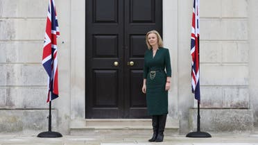 Britain's Foreign Secretary Liz Truss waits to greet Latvia's Foreign Minister Edgars Rinkevics at Chevening House in Sevenoaks, south of London on October 11, 2021. (AFP)