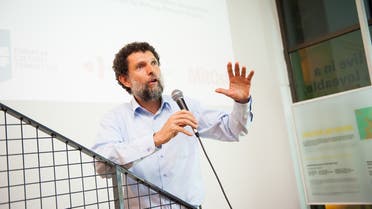This undated handout photograph released on October 15, 2021, by the Anadolu Culture Center shows Parisian-born Turkish philanthropist Osman Kavala speaking during an event in Istanbul. (AFP)