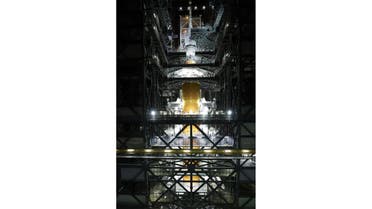This handout image courtesy of NASA released on October 22, 2021 shows Orion spacecraft placed atop the Space Launch System (SLS) Moon rocket, completing assembly for the Artemis I flight test at NASA's Kennedy Space Center in Florida. (AFP)