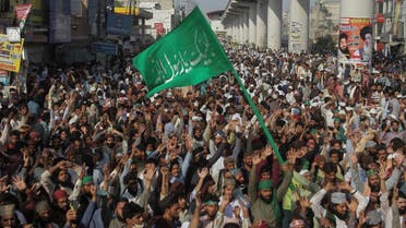 Supporters of the banned political party Tehrik-e-Labaik Pakistan (TLP) chant slogans demanding the release of their leader and the expulsion of the French ambassador over cartoons depicting the Prophet Mohammed, during a protest rally in Lahore, Pakistan, on October 22, 2021. (Reuters)