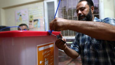An electoral worker prepares to count the ballots after polling stations closed in Benghazi, June 25, 2014. Less than a third of Libyan voters had gone to the polls by late afternoon on Wednesday in a parliamentary election overshadowed by violence. REUTERS/Esam Omran Al-Fetori (LIBYA - Tags: POLITICS ELECTIONS)