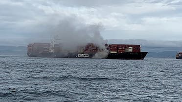 Smoke rises from the container ship Zim Kingston, burning from a fire on board, off the coast of Victoria, British Columbia, Canada October 23, 2021. Canadian Coast Guard/Handout via REUTERS. THIS IMAGE HAS BEEN SUPPLIED BY A THIRD PARTY.
