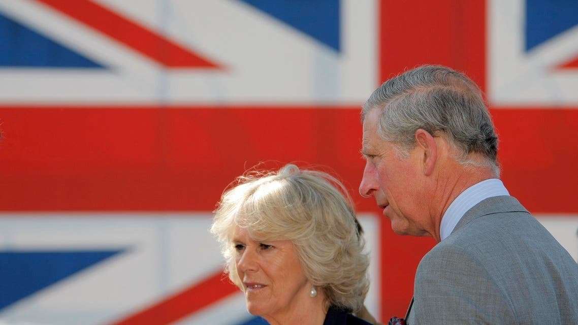 Britain's Prince Charles and his wife Camilla, Duchess of Cornwall stand in front of a Union Jack flag during their visit of the allied museum the in Berlin, April 30, 2009. (Reuters)