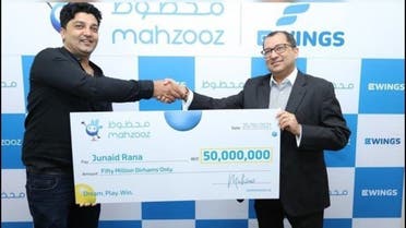 Dubai: Junaid Rana receiving a Fifty Million Dirhams cheque