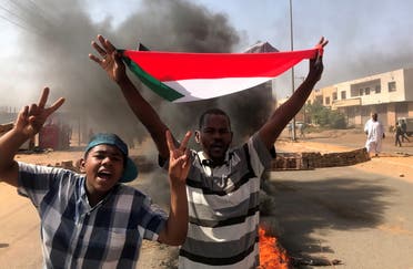A protester waves a flag during what the information ministry calls a military coup in Khartoum, Sudan, October 25, 2021. (File photo: Reuters)