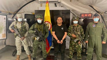 In this photo released by the Colombian presidential press office, one of the country’s most wanted drug traffickers, Dairo Antonio Usuga, alias “Otoniel,” leader of the violent Clan del Golfo cartel, is presented to the media at a military base in Necocli, Colombia, on Oct. 23, 2021. (AP)
