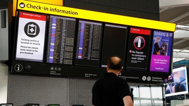 A man looks at a check-in information board in the departures area of Terminal 5 at Heathrow Airport in London, Britain. (Reuters)