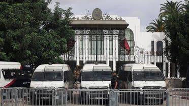 Police cars block the entrance of the Tunisian parliament in Tunis, Friday, Oct. 1, 2021. (AP)