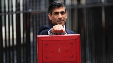 Britain’s Chancellor of the Exchequer Rishi Sunak holds the budget box outside Downing Street in London, Britain, on October 27, 2021. (Reuters)