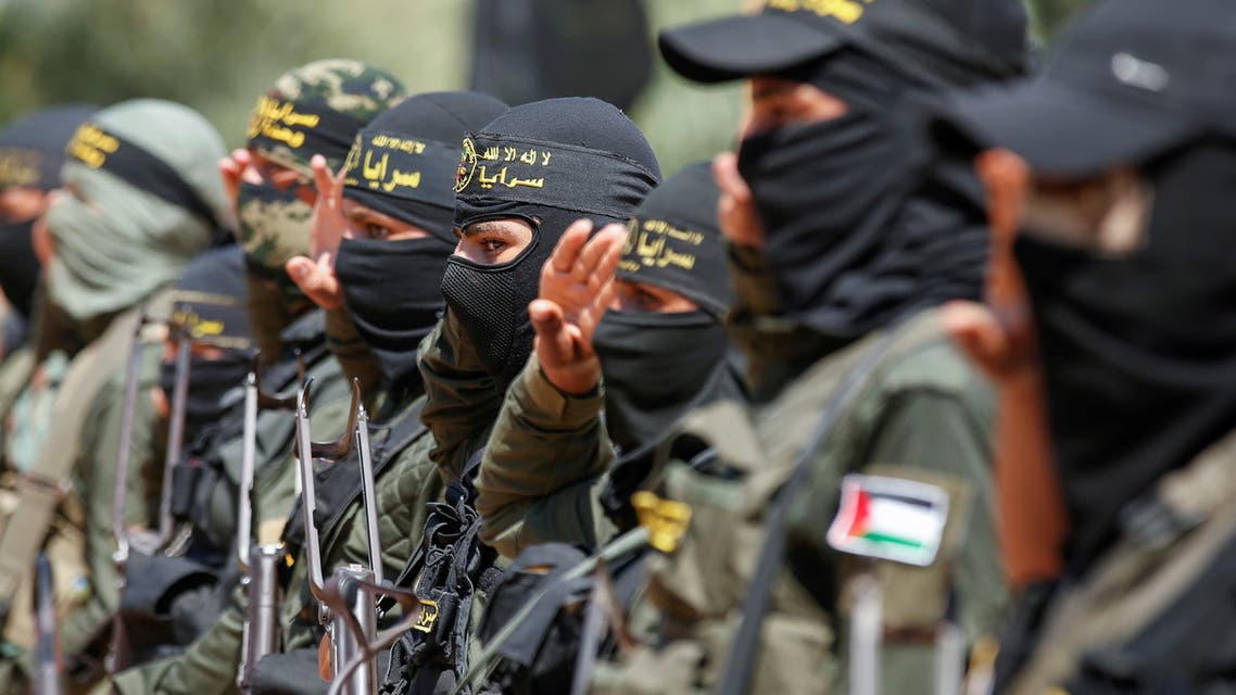 Islamic Jihad militants salute during a graduation ceremony for young Palestinians at a military summer camp organised by the Islamic Jihad Movement, in Gaza City June 30, 2021. REUTERS/Suhaib Salem