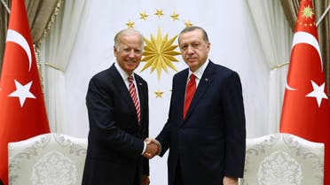 A handout picture taken and released on August 24, 2016 by the Turkey's President Press Service shows then-US Vice President Joe Biden (L) shaking hands with Turkish President Recep Tayyip Erdogan (R) at Turkish Presidential Complex in Ankara. (File photo: AFP)
