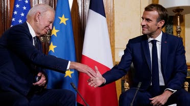 US President Joe Biden, left, shakes hands with French President Emmanuel Macron during a meeting in Rome, Oct. 29, 2021. (AP)