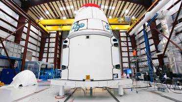 The Space Exploration Technologies, or SpaceX, Dragon spacecraft stands inside a processing hangar at Cape Canaveral Air Force Station in Florida. (Reuters)