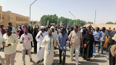 Sudanese demonstrators march and chant during a protest against the military takeover, in Atbara, Sudan October 27, 2021 in this social media image. (Reuters)