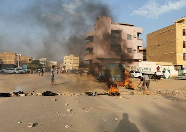 A road barricade is set on fire during what the information ministry calls a military coup in Khartoum, Sudan, October 25, 2021. (Reuters)