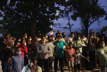 Fans of Bollywood superstar Shah Rukh Khan gather outside his house, Mannat, after his eldest son Aryan Khan was granted bail by the Bombay High Court more than three weeks after he was arrested in a drugs case, in Mumbai, India, on October 28, 2021. (Reuters)