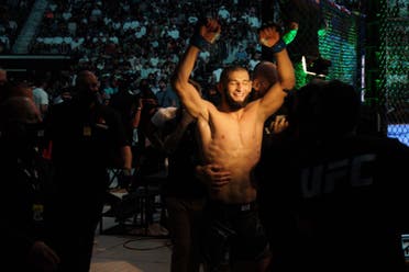 Khamzat Chimaev celebrates after winning his welterweight bout against Li Jingliang at UFC 267 in Abu Dhabi. (Al Arabiya English)