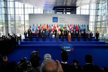 World leaders pose for a group photo at the La Nuvola conference center for the G20 summit in Rome, Saturday, Oct. 30, 2021. The two-day Group of 20 summit is the first in-person gathering of leaders of the world's biggest economies since the COVID-19 pandemic started. (AP) 