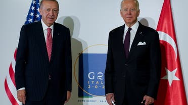 U.S. President Joe Biden and Turkey's President Tayyip Erdogan pose for a photo as they attend a bilateral meeting, on the sidelines of the G20 leaders' summit in Rome, Italy October 31, 2021. REUTERS/Kevin Lamarque