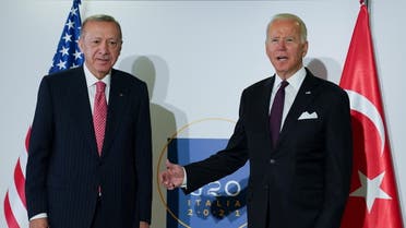 U.S. President Joe Biden and Turkey's President Tayyip Erdogan pose for a photo as they attend a bilateral meeting, on the sidelines of the G20 leaders' summit in Rome, Italy October 31, 2021. REUTERS/Kevin Lamarque