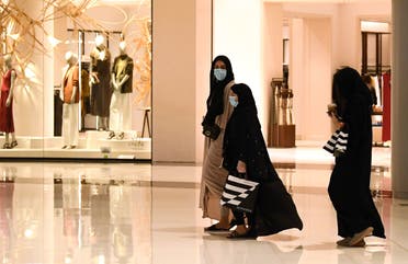 Women wearing masks for protection against the coronavirus, walk in the Dubai Mall on April 28, 2020. (File photo: AFP)