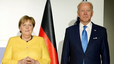 President Joe Biden and Germany’s Chancellor Angela Merkel pose for a photo during their meeting with Britain’s Prime Minister Boris Johnson and France’s President Emmanuel Macron to discuss Iran’s nuclear program, on the sidelines of the G20 leaders’ summit in Rome, Italy, on October 30, 2021. (Reuters)