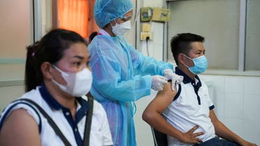 People receive an AstraZeneca coronavirus disease (COVID-19) vaccine as a booster dose at the National Pediatric Hospital in Phnom Penh, Cambodia, August 12, 2021.REUTERS/Cindy Liu