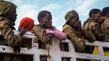 Captured Ethiopian government soldiers and allied militia members are paraded by Tigray forces through the streets in open-top trucks, as they arrived to be taken to a detention center in Mekele, the capital of the Tigray region of northern Ethiopia, on Oct. 22, 2021. (AP)