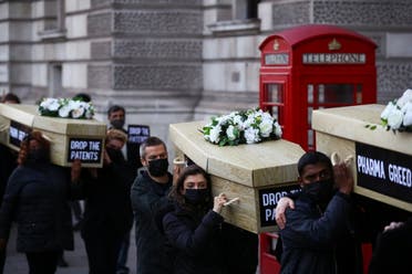 Members of Global Justice Now protest carrying coffins through Westminster to highlight the global number of deaths from the coronavirus disease (COVID-19), in London, Britain October 12, 2021. (Reuters)