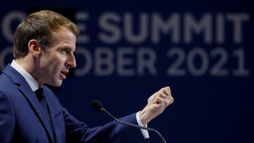 France's President Emmanuel Macron gestures as he addresses media representatives at a press conference in Rome on October 31, 2021, during the G20 Summit. (AFP)