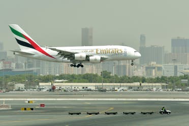 A picture take on September 14, 2017 shows an Airbus A380 of Emirates landing at the tarmac at Dubai's International Airport. (AFP)