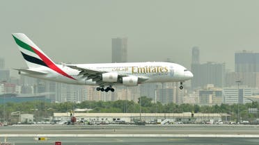 A picture take on September 14, 2017 shows an Airbus A380 of Emirates landing at the tarmac at Dubai's International Airport. (AFP)