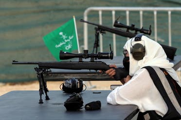Saudi female firearm trainer, Mona Al Khurais, takes aim with her long-range rifle during her target practice at the Top-Gun shooting range in Riyadh, Saudi Arabia, October 28, 2021. Picture taken October 28, 2021. (Reuters)