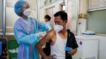 FILE PHOTO: A man receives the AstraZeneca coronavirus disease (COVID-19) vaccine as a booster dose at the National Pediatric Hospital in Phnom Penh, Cambodia, August 12, 2021. REUTERS/Cindy Liu/File Photo