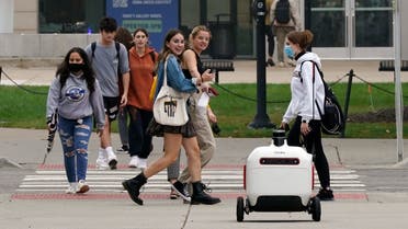 A food delivery robot crosses a street in Ann Arbor, Mich. on Thursday, Oct. 7, 2021. (AP)