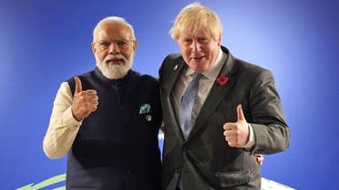 Britain’s Prime Minister Boris Johnson greets India's Prime Minister Narendra Modi ahead of their bilateral meeting during the UN Climate Change Conference (COP26) in Glasgow, Scotland, Britain, on November 1, 2021. (Reuters)