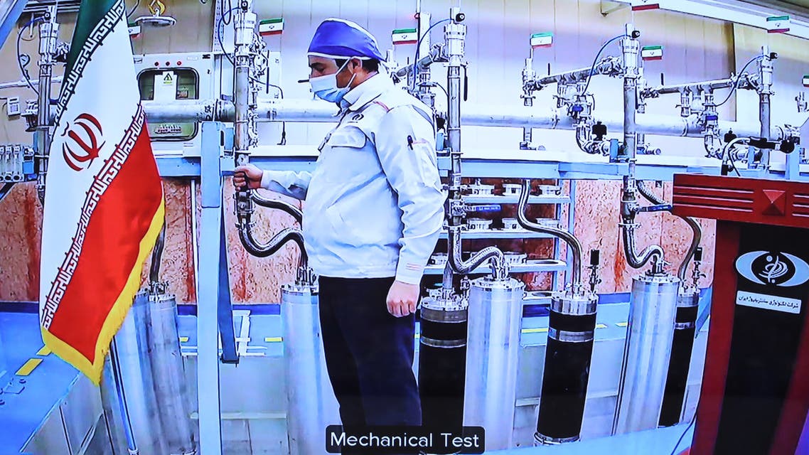 A handout picture provided by the Iranian presidential office on April 10, 2021, shows a grab of a videoconference screen of an enginere inside Iran's Natanz uranium enrichment plant, shown during a ceremony headed by the country's president on Iran's National Nuclear Technology Day, in the capital Tehran. Iran announced today it has started up advanced uranium enrichment centrifuges in a breach of its undertakings under a troubled 2015 nuclear deal, days after talks on rescuing it got underway.