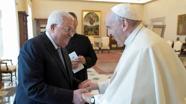 Palestinian President Mahmud Abbas shakes hands with Pope Francis during a meeting in Vatican, November 4, 2021. (Vatican Media/­Handout via Reuters)